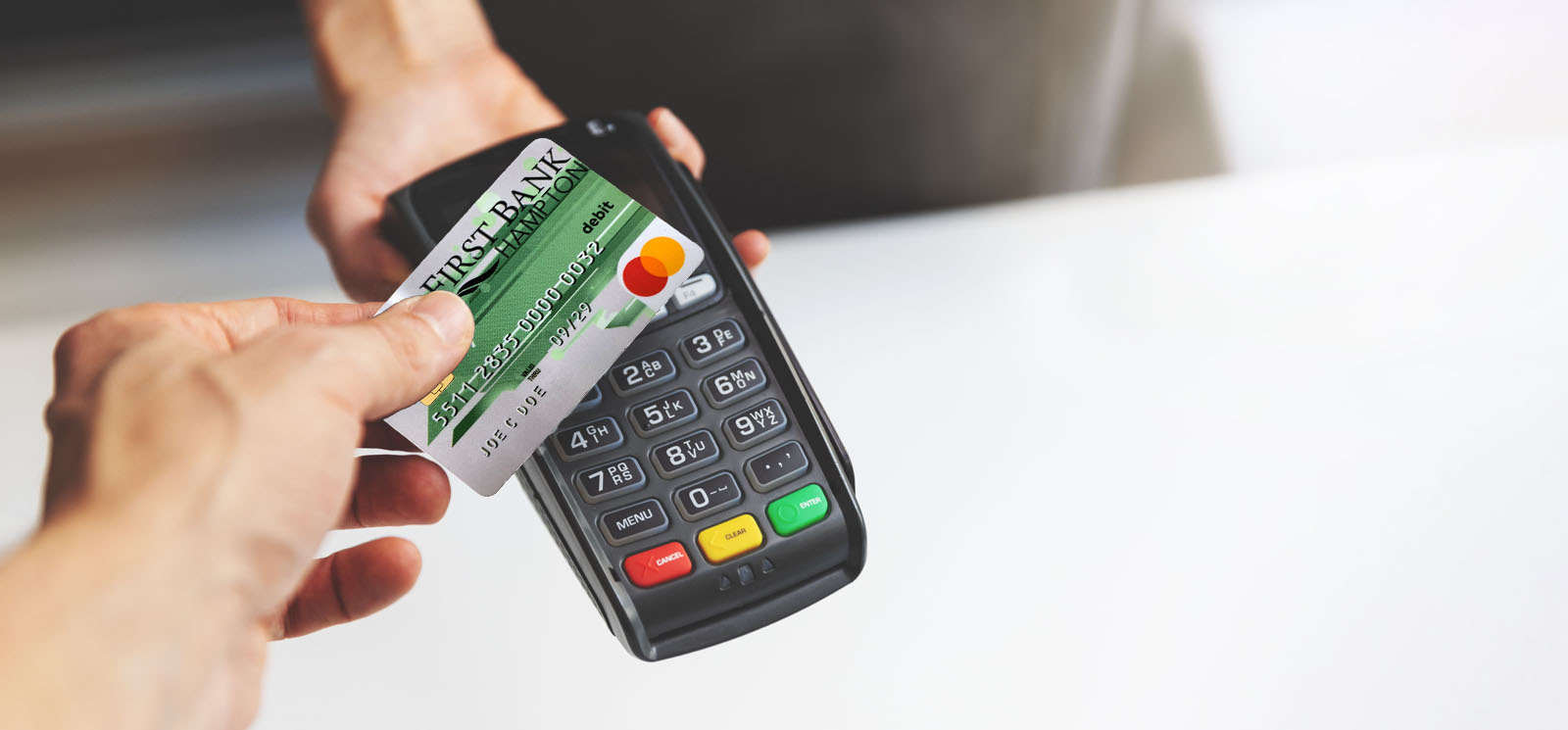 nfc contactless payment using First Bank Hampton debit card at pos terminal.